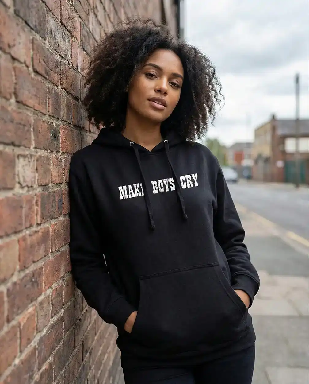 Make Boys Cry Graphic Hoodie, dark base hoodie with high-contrast text graphic, streetwear essential.